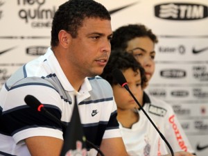 Ronaldo’s Picture, his head down, in front of the microphone with his two sons.