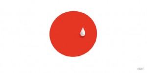 Audiodescrição em jornais: a charge de Jean mostra a bandeira do Japão: círculo vermelho em fundo branco, e sobre o círculo, do lado direito, uma lágrima.